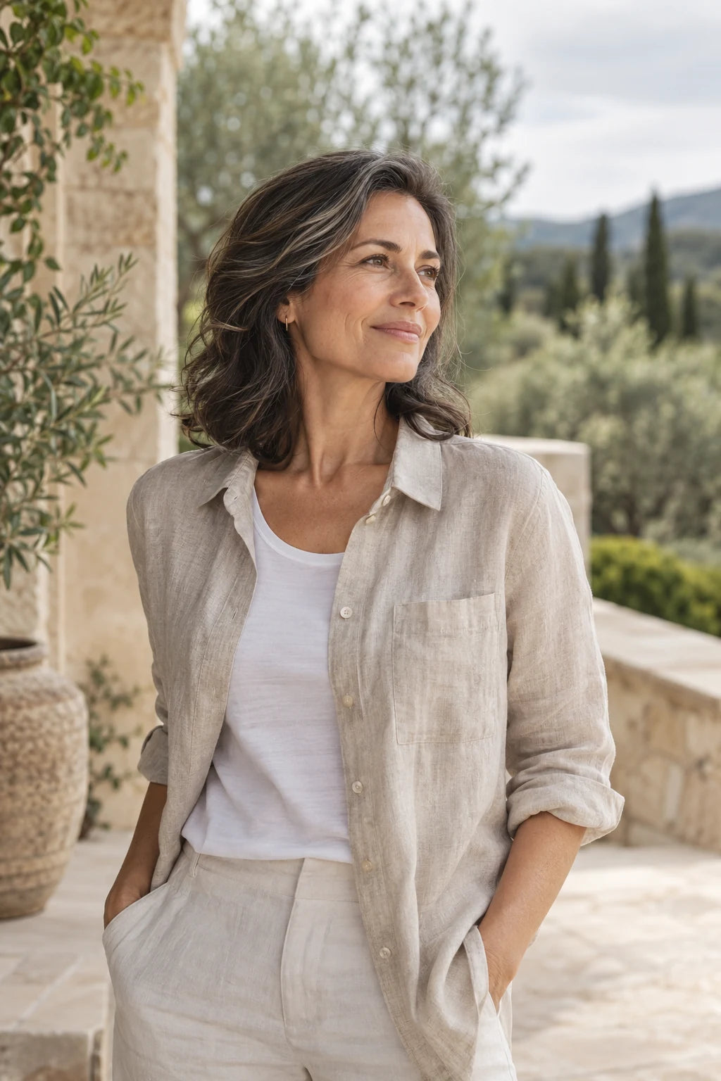Woman enjoying a calm morning on a garden terrace